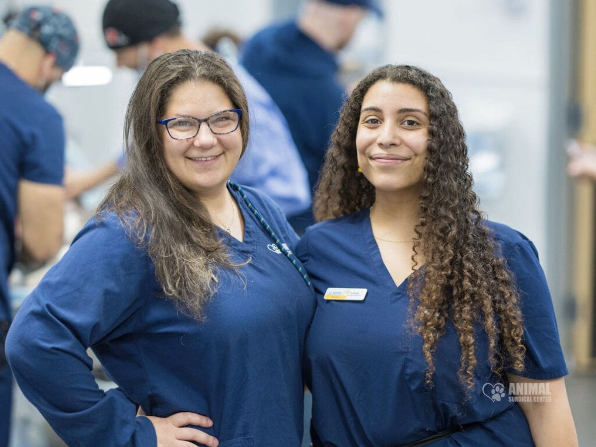 Nicole, Licensed Veterinary Technician, and Alyssa, Vet Assistant and Social Media Manager, smiling together at Animal Surgical Center.